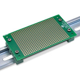 Back of 2 inch by 3 inch perfboard with DIN clips
