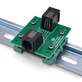 Back of RJ11 pass-through breakout board on DIN rail