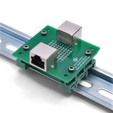 Back of RJ45 pass-through breakout board with DIN rail clips