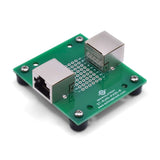 Back of RJ45 pass-through breakout board with rubber feet